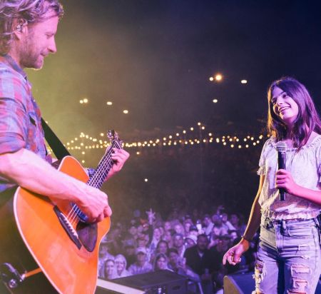 Dierks Bentley surprised his fans by bringing his 12-year-old daughter Evie out on stage to join him in singing his hit "Different for Girls".